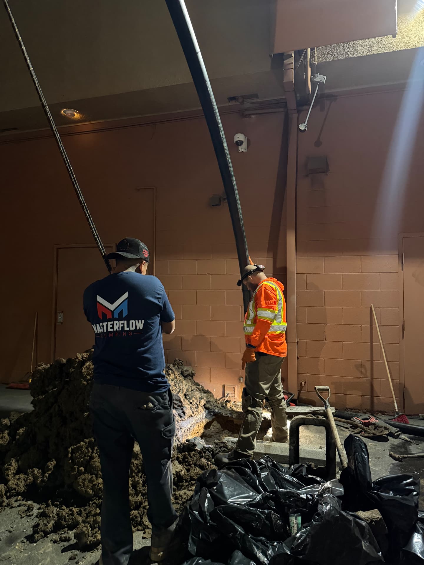 Masterflow crew clearing debris after interior pipe burst