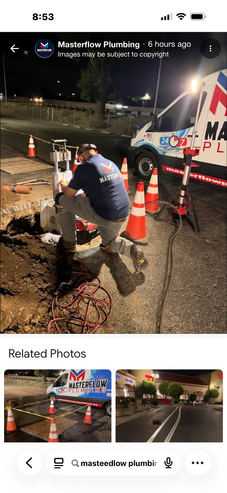 Masterflow plumber working on excavated pipe burst repair with work lights